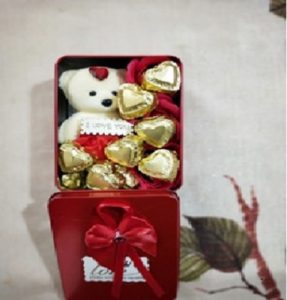 Red decorative box with teddy and chocolates